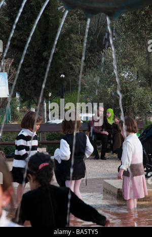 Israel jerusalem Lions fountain children and couple enjoying an outing Stock Photo