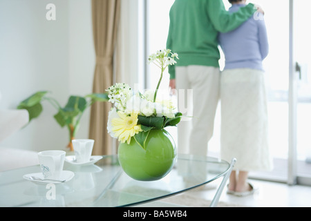 Couple standing in front door Stock Photo