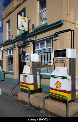 petrol gas pumps on the street outside mccleans combined bar shop petrol station in malin inishowen county donegal Stock Photo