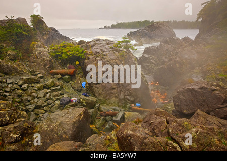 People bathing in the rocky pools of the geothermal hot springs at Hot Springs Cove Openit Peninsula Maquinna Marine Provincial. Stock Photo