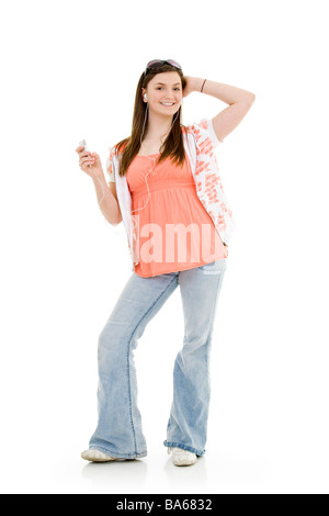 Teenage girl listening to music on white background Stock Photo