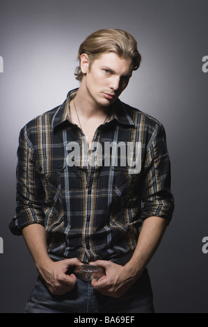 Man young carelessly stands semi-portrait rock musicians newcomers Mickey Monroe heeds personality-rights series people 20-30 Stock Photo