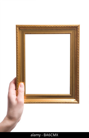 Woman's hand holding a golden photo frame Stock Photo