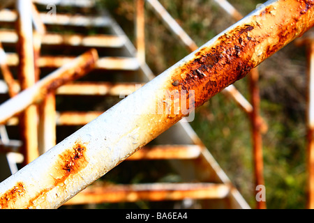 Rusty staircase and banister in foreground Stock Photo