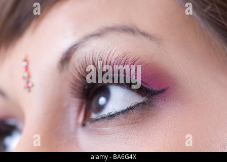 Close up of a young Asian woman's eyes looking up Stock Photo