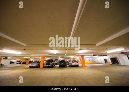 Underground parking garage; multi-story car park; parking structure with cars in Washington DC. Stock Photo
