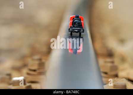 Steam locomotive engine, train model railway on real track outside still life detail Stock Photo