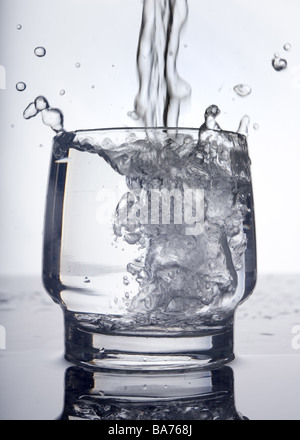 Tumbler water pours splashes glass tumbler drinking water moves dynamically fills healthy clearly clarity purely purity bubbles Stock Photo