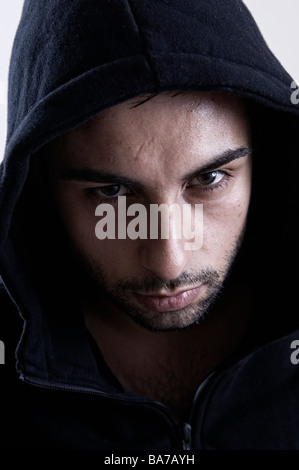 Close up of a thug with wearing a hoody Stock Photo