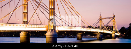 Albert Bridge crossing River Thames in London England UK Stock Photo