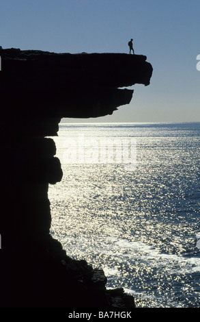 Hiker on top of Eagle Rock on the coast of the national park, Royal National Park, New South Wales, Australia Stock Photo