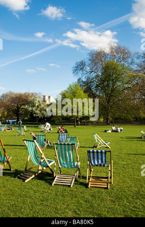 Deck chairs in a park in spring Stock Photo - Alamy