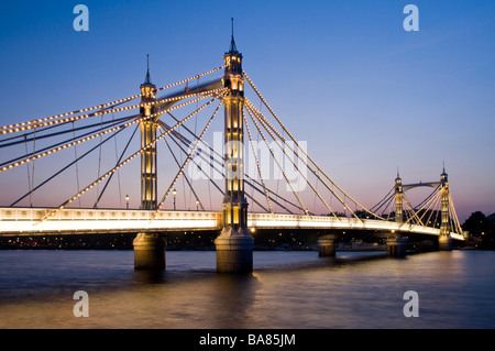 Albert Bridge crossing River Thames in London England UK Stock Photo