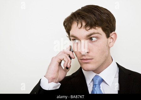 Young business man on cell phone. Stock Photo