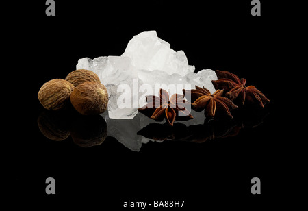 crystal sugar and spice over black reflective surface background Stock Photo