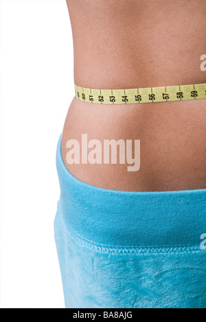 Slender woman measuring her waist with metric tape measure after a diet,  isolated 16406784 PNG