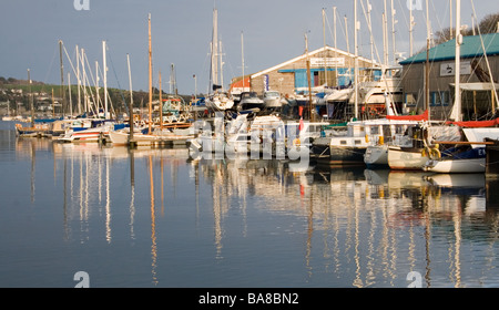 Yachts tied up along the Penryn river on a sunny evening. Stock Photo