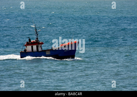 Anjo do Mar fishing boat putting out to sea off Madeira Stock Photo