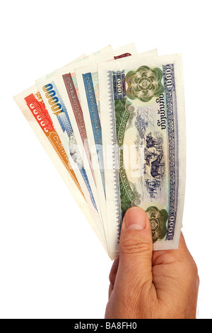 Money male hand holding handful of Lao currency Stock Photo