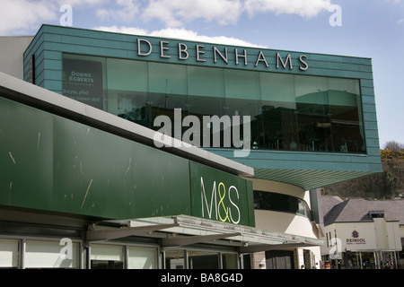 City of Bangor, Wales. Close up view of the Marks and Spencer and Debenhams department store signs in Bangor’s Garth Road. Stock Photo
