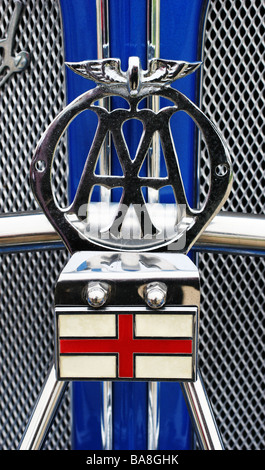Vintage AA Automobile Association badge logo above the England flag on a classic british sportscar Stock Photo