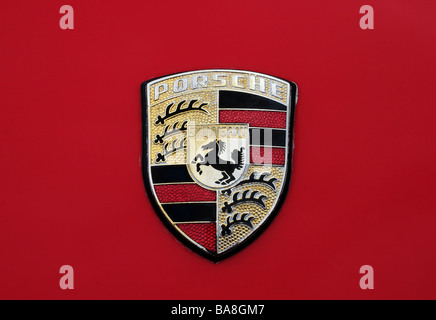 Porsche automobile badge / logo on red bodywork Stock Photo