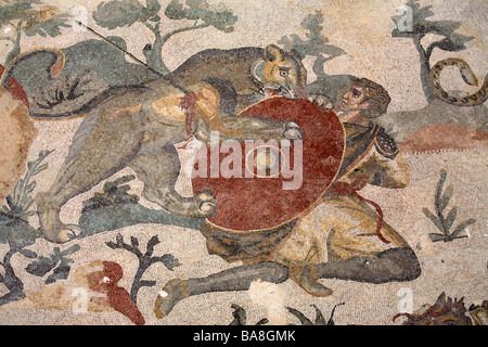 Mosaic of hunter fighting lioness in Villa del Casale, Piazza Armerina, Sicily, Italy Stock Photo