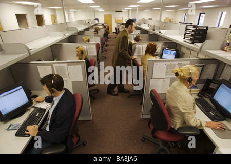 Executives at work in office setting with computer. Stock Photo