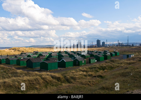Fisherman's huts and Steelworks, Paddy's Hole, Redcar, Teesside Stock Photo