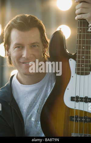 Man holding electric guitar Stock Photo