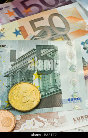 Assorted euro notes and coins Stock Photo