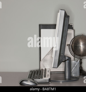 Computer and globe on office desk Stock Photo