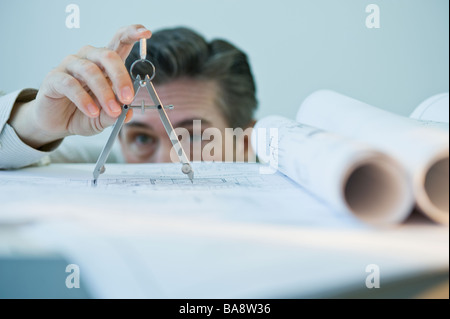 Architect using drawing compass Stock Photo