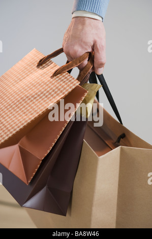 Man carrying shopping bags Stock Photo