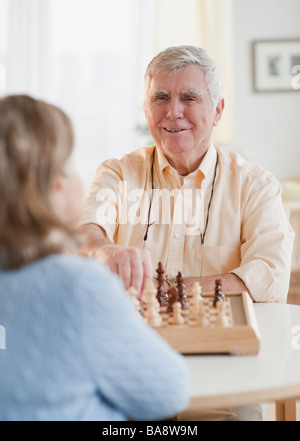 Senior couple playing chess Stock Photo