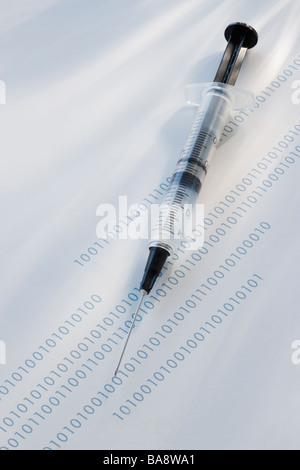 Syringe on binary code Stock Photo