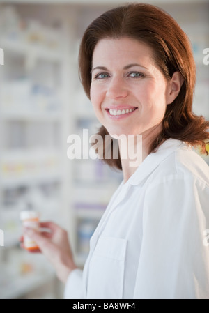 Pharmacist filling prescription Stock Photo