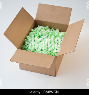Packing peanuts in cardboard box Stock Photo