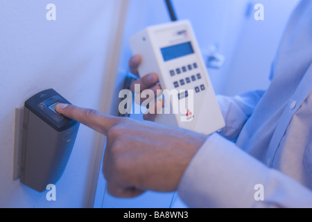 Computer technicians clean servers in high tech environment. Stock Photo