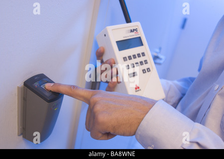 Computer technicians clean servers in high tech environment. Stock Photo