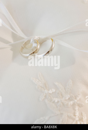 Close up of wedding rings on pillow Stock Photo