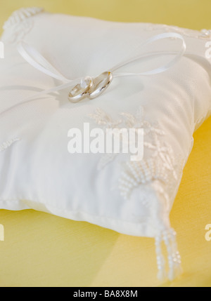 Wedding rings on pillow Stock Photo