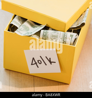 401k box full of paper money Stock Photo