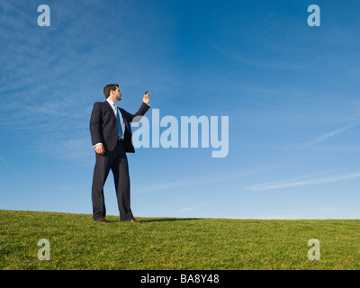 Businessman using cell phone outdoors Stock Photo
