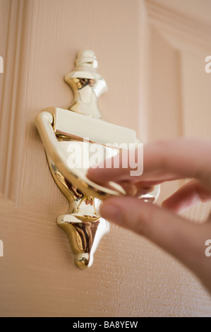 Person knocking on door Stock Photo