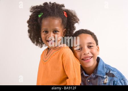 Portrait of African American boy and girl, studio shot Stock Photo