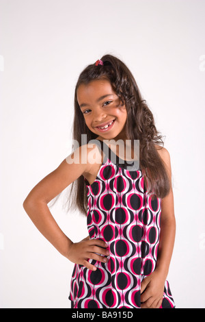 Portrait of stylish African American girl in dress, studio shot Stock Photo