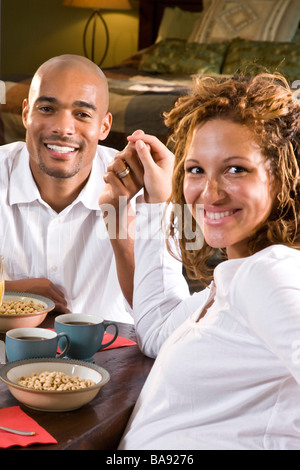 African-American couple having breakfast, expectant parents Stock Photo