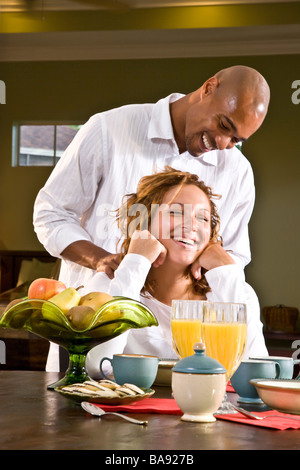 Affectionate African-American couple having breakfast Stock Photo