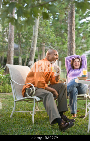 African-American couple having breakfast outside Stock Photo